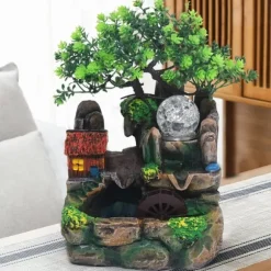 Bordsfontän - Inomhusfontän - LED-belysning - Konstgjorda träd - Klipplandskap - Cirkulerande vatten - 27 x 20 x 16 cm - Harts