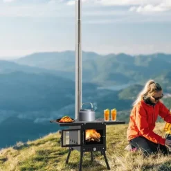 Utomhus campingkamin - Ved- och kolspis - Rökavledning med skorsten - Hopfällbar 31,5×22×21 cm - Kolstål & rostfritt, glas - Vikt 8 kg - Svart