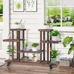Växtställ 4 nivåer massivt kolat trä 123,5x33x80 cm trädgård/balkong